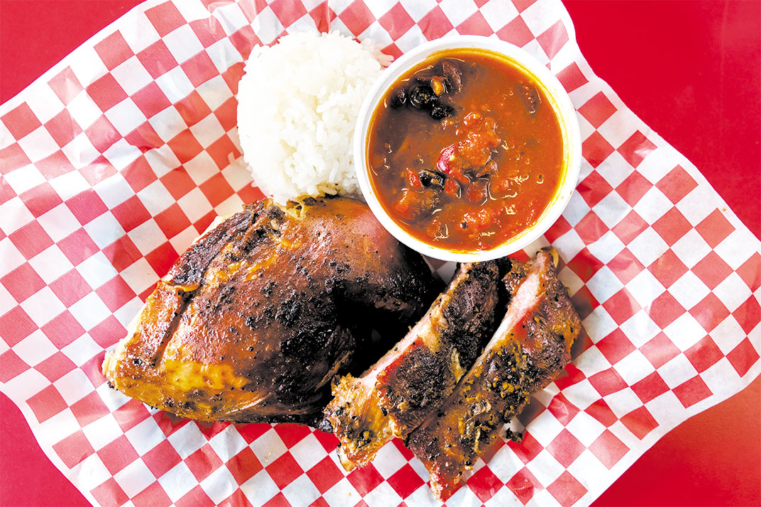 Chicken in a Barrel BBQ signature dishes Barrel-Cooked Chicken, Ribs, Pulled Pork, Beef Brisket, various barbecue sauces.